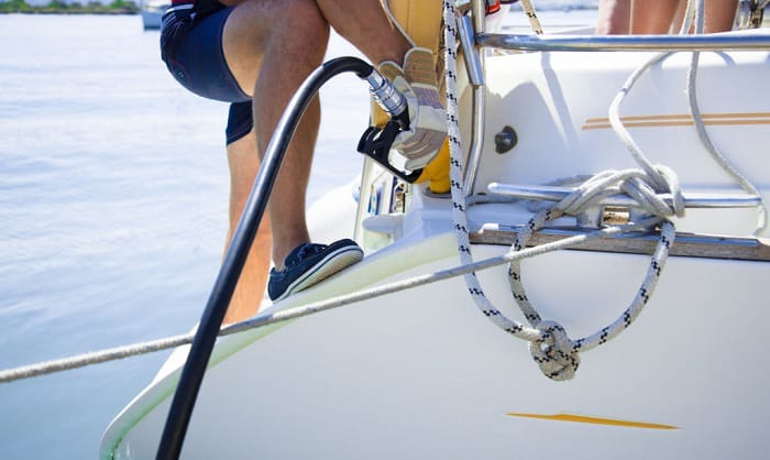 what safety precaution should you take while filling the fuel tank of a gasoline powered boat