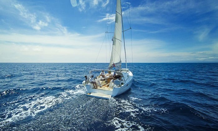 sailboat is underway in the fog sound signal